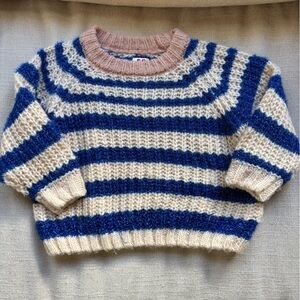Blue and beige stripe sweater with pink collar.